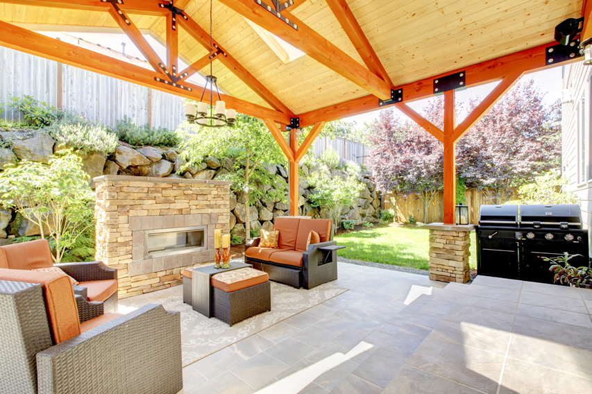 covered-patio-orange-outdoor-fireplace-barbeque-area