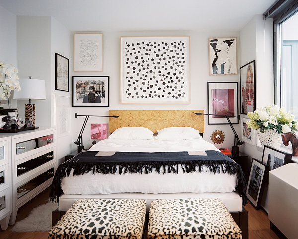 Gallery-style wall art in a modern eclectic bedroom