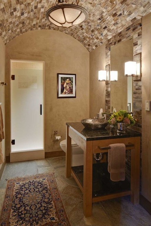 Mediterranean Bathroom with simple granite