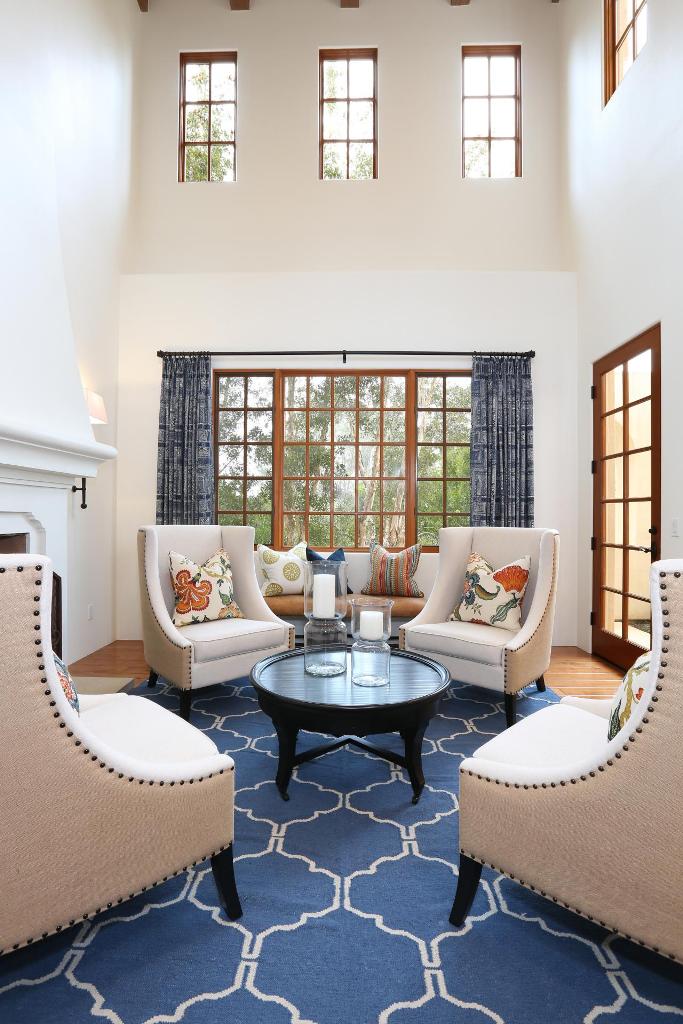 White Mediterranean Living Room With Blue Rug